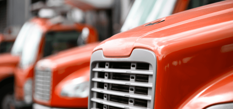 Front grill of a red United Vision Logistics 18-wheeler truck